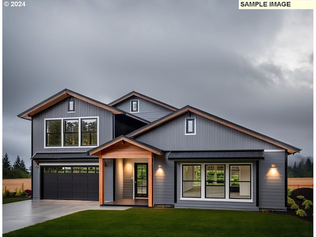 view of front of home featuring covered porch, a front yard, and a garage