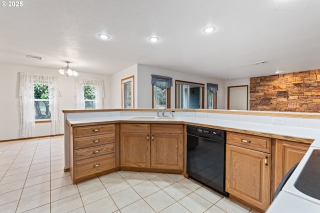 kitchen with dishwasher, light tile patterned flooring, a notable chandelier, and sink