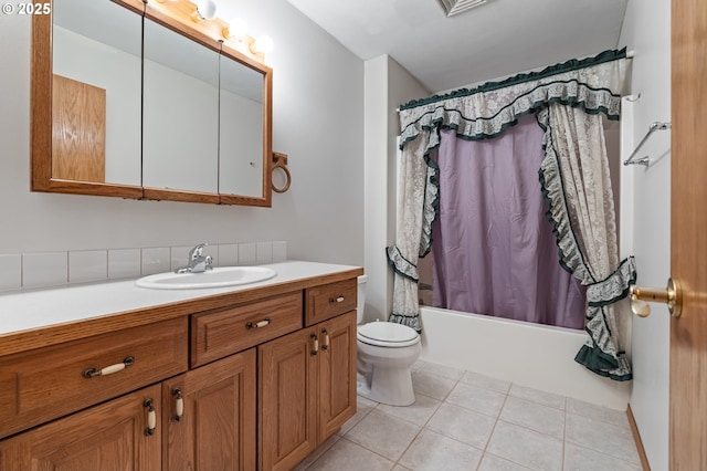 full bathroom featuring tile patterned flooring, vanity, shower / tub combo with curtain, and toilet