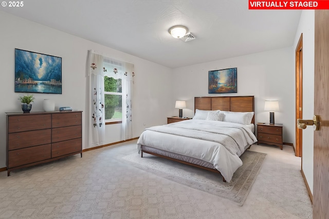 bedroom featuring light carpet