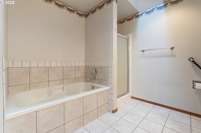 bathroom featuring tile patterned flooring and independent shower and bath