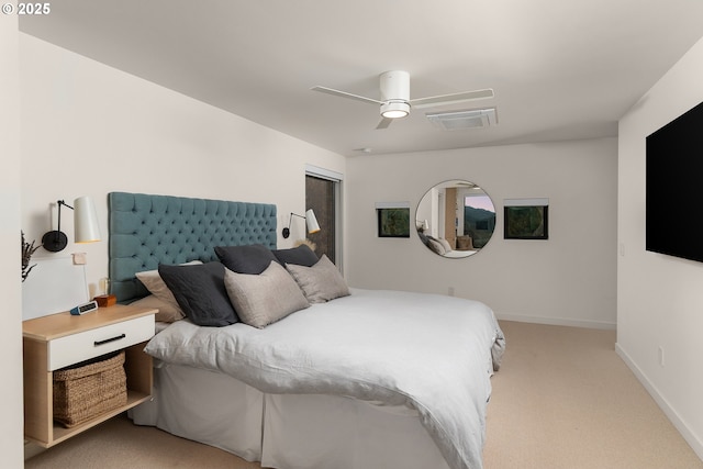 bedroom featuring light carpet and ceiling fan