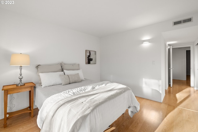 bedroom with light hardwood / wood-style floors