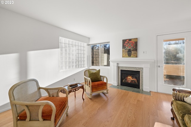 sitting room with light hardwood / wood-style floors