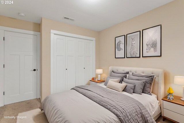 carpeted bedroom featuring a closet