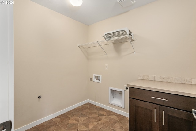 laundry area featuring hookup for a washing machine, cabinets, and electric dryer hookup