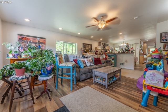 93777 Green Acres Ln, Coos Bay, OR 97420 - living room with ceiling fan, a chandelier, wood finished floors, and recessed lighting