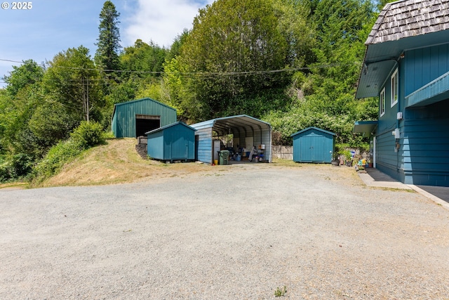 93777 Green Acres Ln, Coos Bay, OR 97420 - garage with a shed, a carport, and driveway