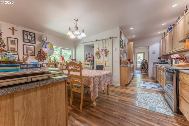 93777 Green Acres Ln, Coos Bay, OR 97420 - dining space featuring light wood-style flooring, a chandelier, a barn door, and recessed lighting