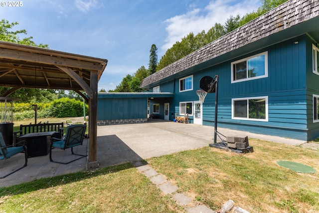 93777 Green Acres Ln, Coos Bay, OR 97420 - back of property with a patio area, a yard, and an outdoor fire pit