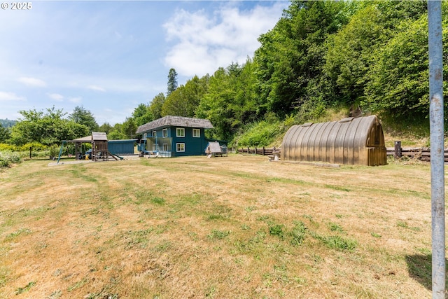 93777 Green Acres Ln, Coos Bay, OR 97420 - view of yard with a playground and an outbuilding