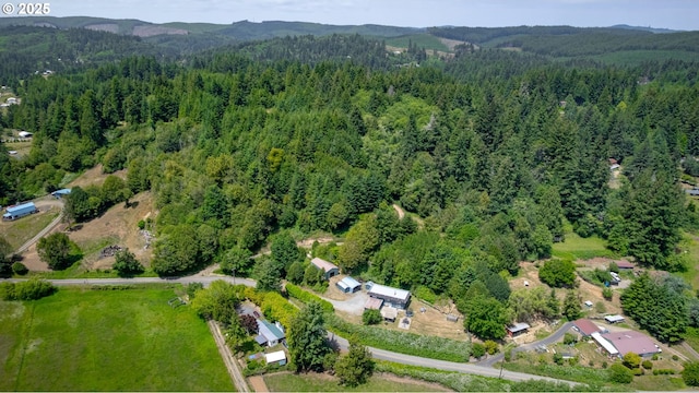 93777 Green Acres Ln, Coos Bay, OR 97420 - aerial view of property's location with a forest and a mountain backdrop