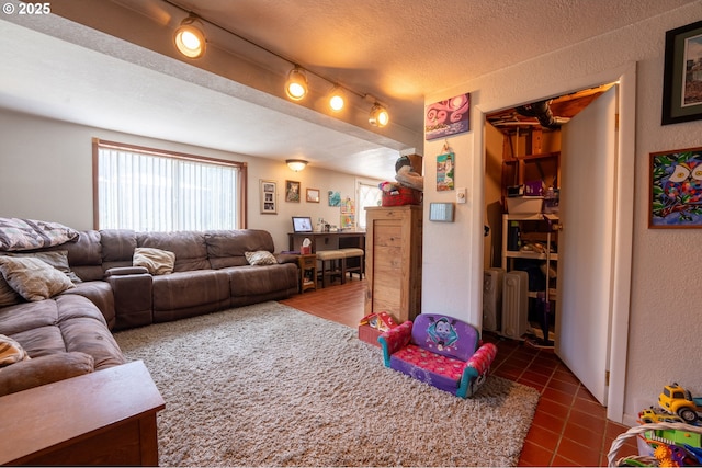 93777 Green Acres Ln, Coos Bay, OR 97420 - living area featuring dark tile patterned flooring and a textured wall