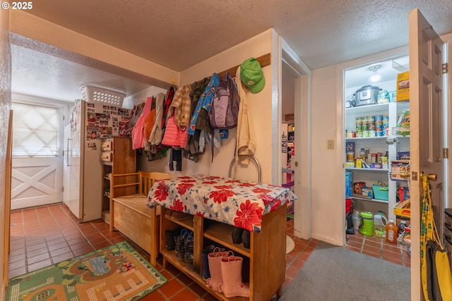 93777 Green Acres Ln, Coos Bay, OR 97420 - mudroom with a textured ceiling and tile patterned floors