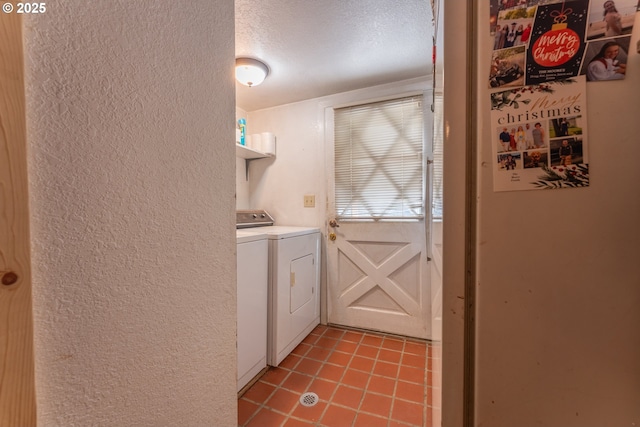 93777 Green Acres Ln, Coos Bay, OR 97420 - washroom featuring a textured wall, washer and dryer, light tile patterned floors, and a textured ceiling