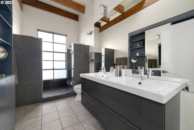 bathroom with beam ceiling, tile patterned flooring, toilet, vanity, and tile walls