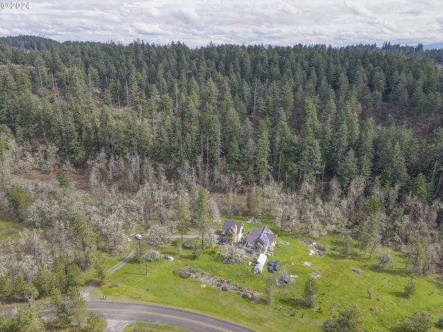 bird's eye view featuring a forest view