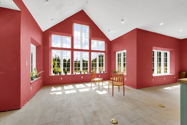 interior space featuring vaulted ceiling and plenty of natural light