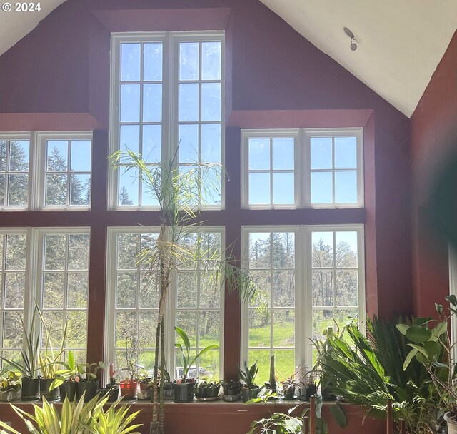 interior space with lofted ceiling and a wealth of natural light