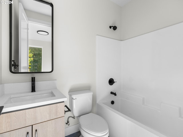 full bathroom featuring bathing tub / shower combination, vanity, and toilet