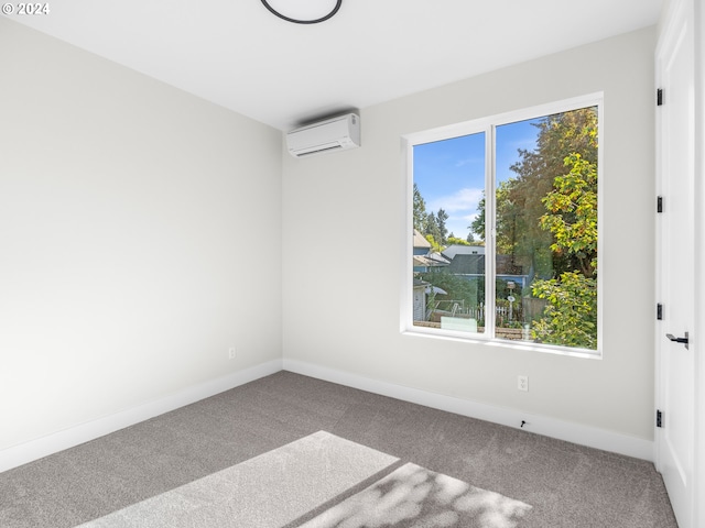 carpeted spare room with a wall mounted air conditioner and a wealth of natural light