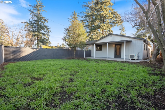 view of yard with ac unit and a patio