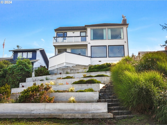 view of front of property with a balcony