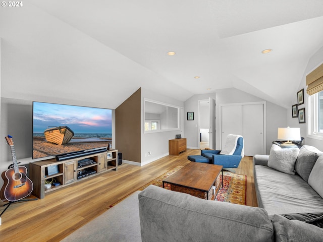 living room with vaulted ceiling and hardwood / wood-style floors