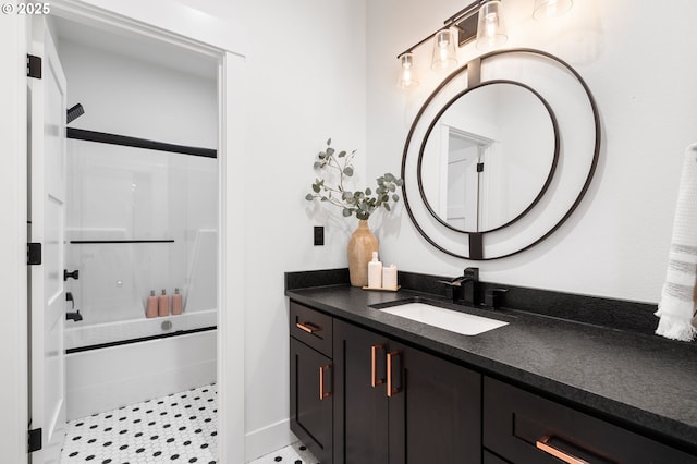 bathroom with vanity and washtub / shower combination