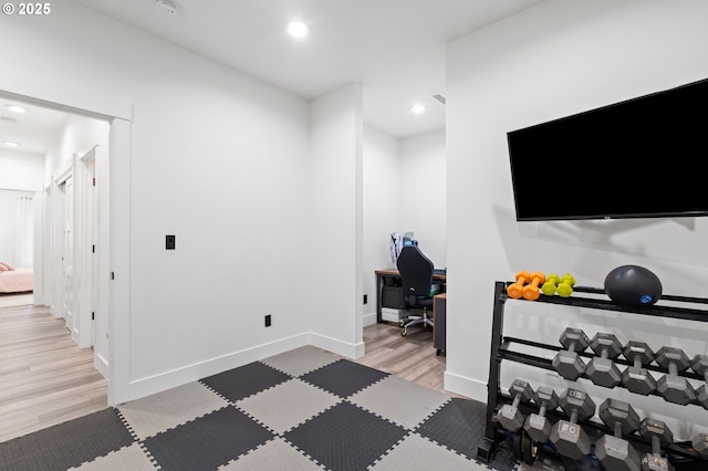 interior space with recessed lighting, light wood-type flooring, and baseboards