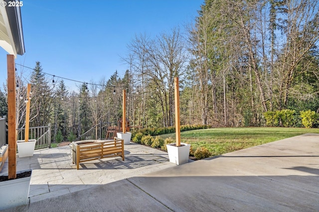 view of patio with a view of trees