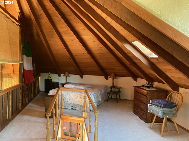 bedroom with lofted ceiling with skylight, light colored carpet, and wooden ceiling