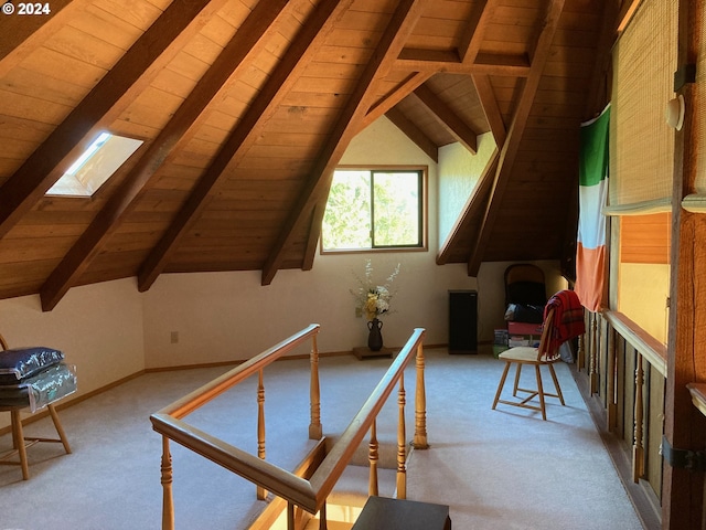 rec room with light carpet, vaulted ceiling with skylight, and wood ceiling