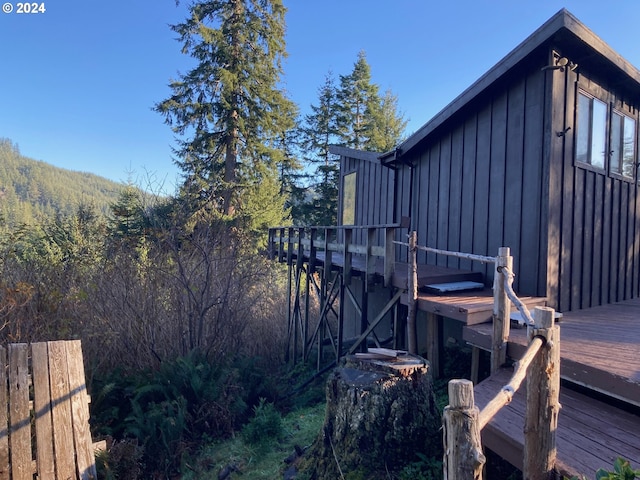 view of side of property featuring a deck