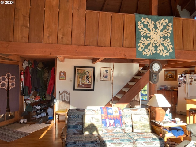 living room featuring hardwood / wood-style floors and beamed ceiling