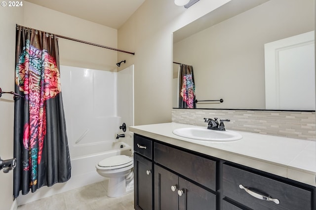 full bathroom featuring vanity, tile patterned flooring, decorative backsplash, toilet, and shower / bath combo with shower curtain