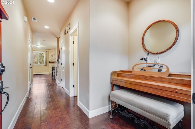 hallway with dark hardwood / wood-style flooring