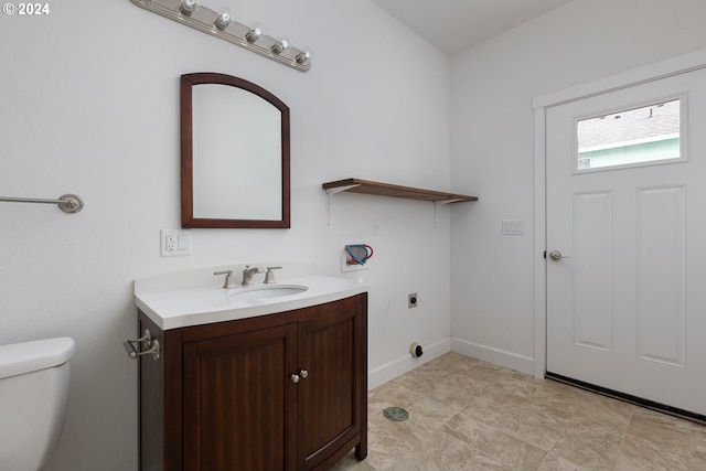 interior space with vanity and toilet