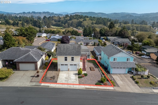 drone / aerial view featuring a mountain view