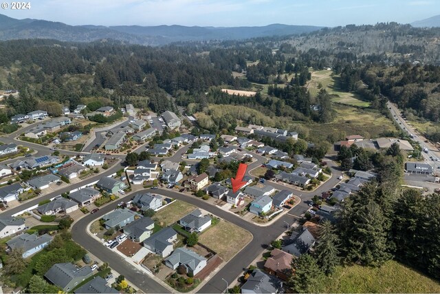 drone / aerial view featuring a mountain view