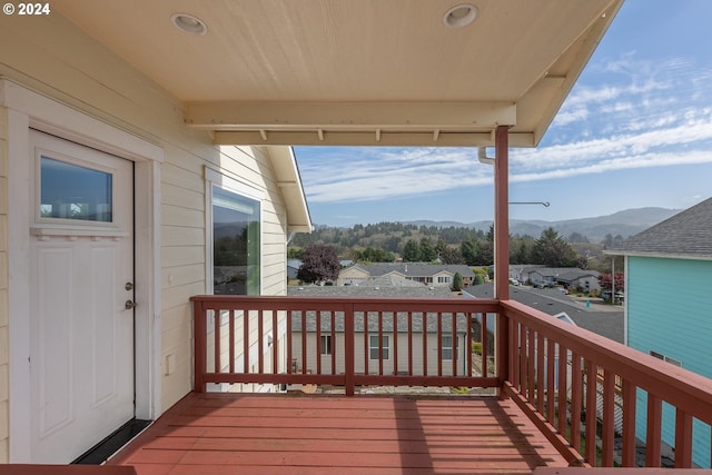 wooden deck with a mountain view