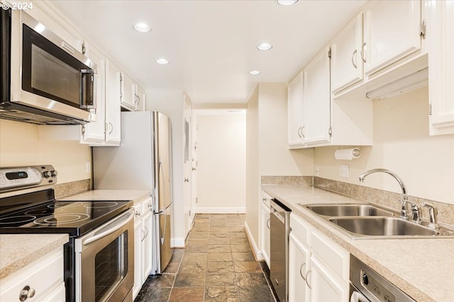 kitchen with white cabinets, sink, and stainless steel appliances