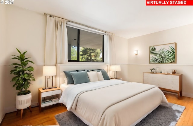 bedroom featuring hardwood / wood-style flooring