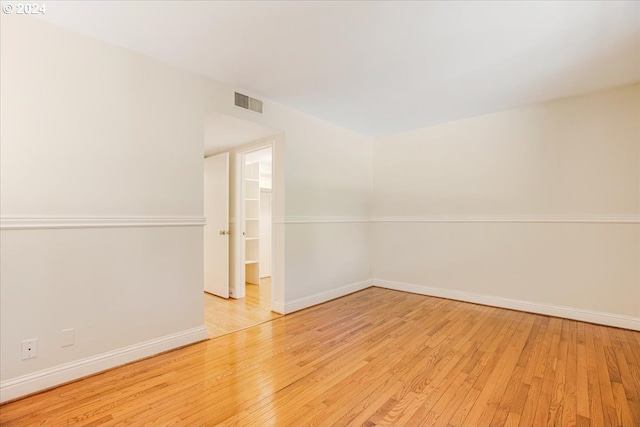 unfurnished room with light wood-type flooring