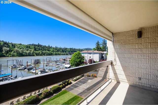 balcony featuring a water view