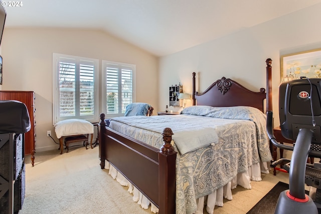 bedroom featuring light carpet and lofted ceiling