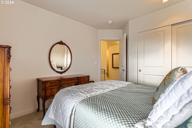 carpeted bedroom featuring a closet