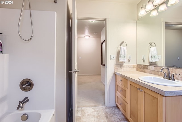 bathroom featuring tile patterned floors, vanity, and  shower combination