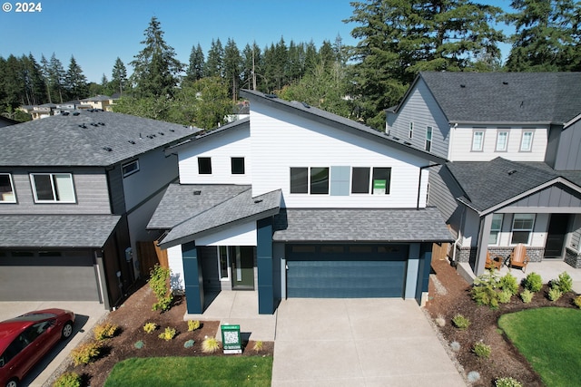 view of front of house with covered porch and a garage