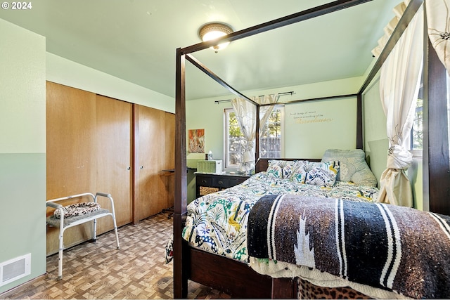 bedroom featuring parquet floors